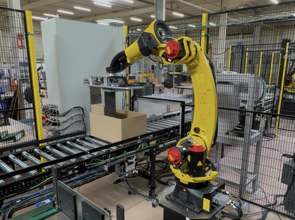 Robots FANUC de mise en carton et palettisation illustrant un projet réalisé pour ACTEMIUM